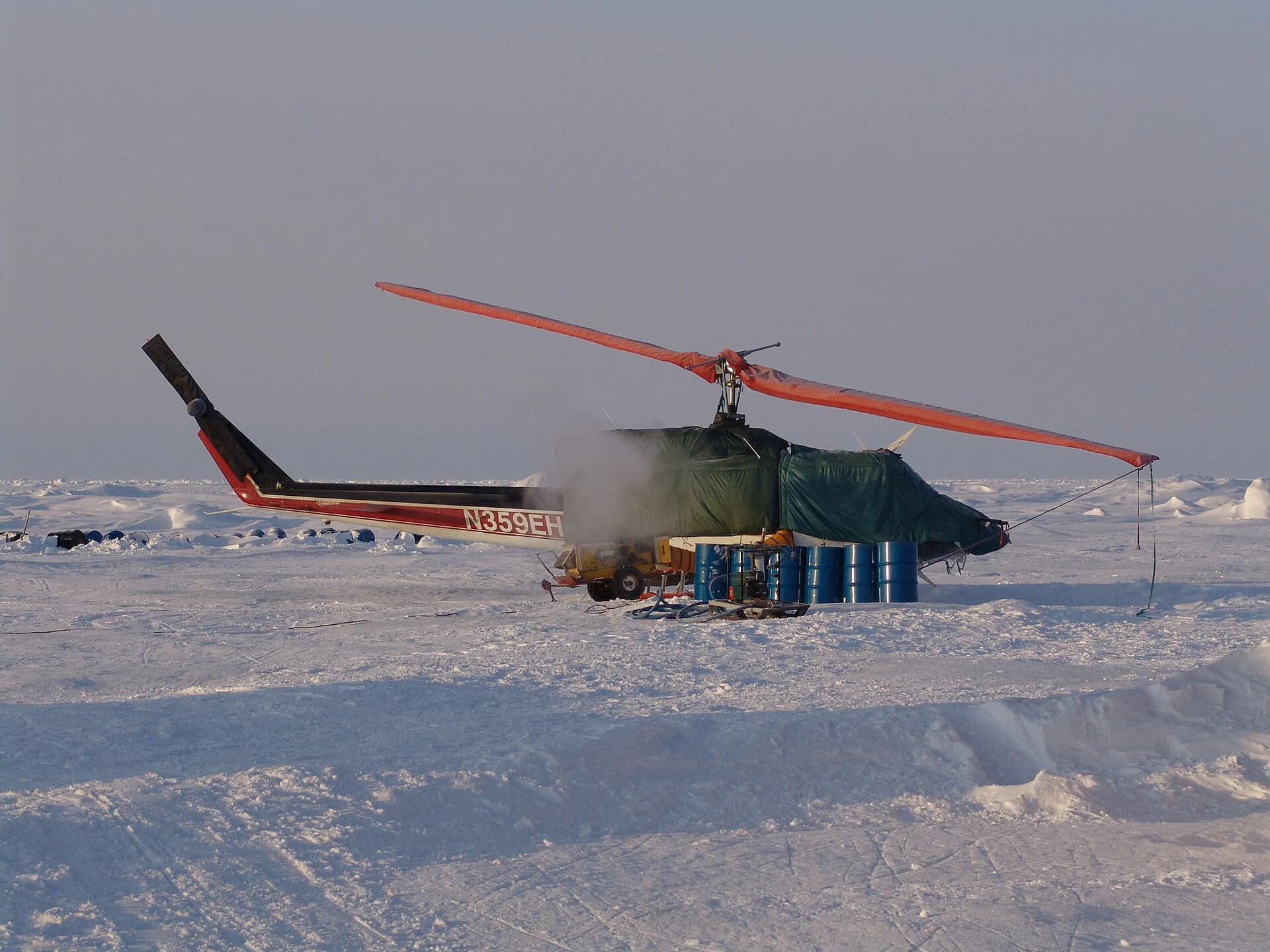 A Bell 212 prepared for work in an Arctic field camp